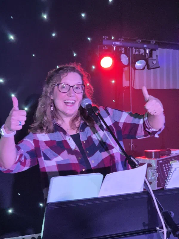 Sarah behind her keyboard rig at a band gig