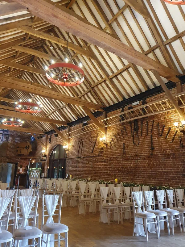 Barn venue with chairs set for an unplugged wedding ceremony
